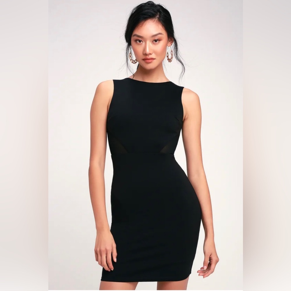 Black open back mini dress with mesh details.